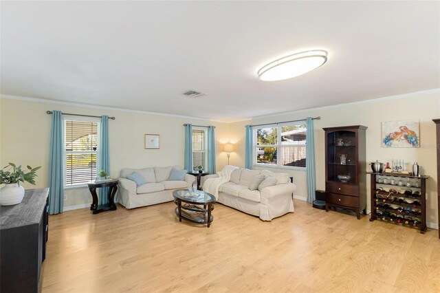 218 N Bay Hills Blvd, Safety Harbor, FL 34695 - living area featuring light wood-type flooring and ornamental molding