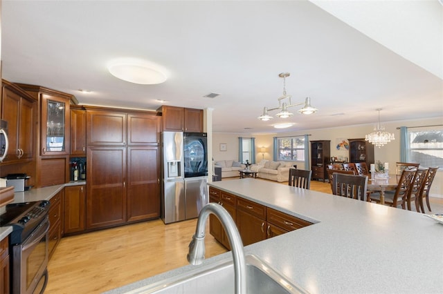 218 N Bay Hills Blvd, Safety Harbor, FL 34695 - kitchen with stainless steel appliances, plenty of natural light, and light countertops