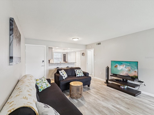 214 Meadow Ln Unit 214, Oldsmar, FL 34677 - living area with light wood-style floors and baseboards