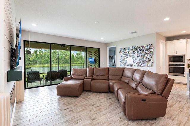 12646 Oak Hill Way, Parrish, FL 34219 - living room featuring light wood-type flooring and recessed lighting
