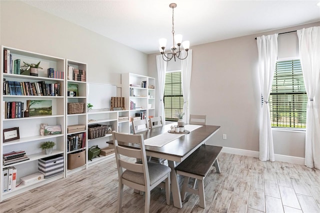 12646 Oak Hill Way, Parrish, FL 34219 - dining room featuring a chandelier and wood finished floors