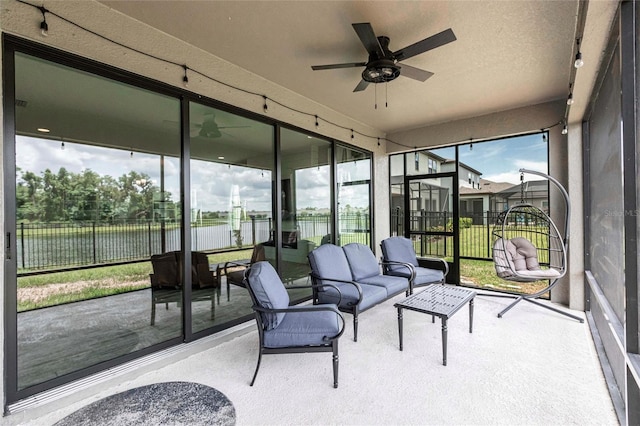 12646 Oak Hill Way, Parrish, FL 34219 - sunroom / solarium with a ceiling fan, a water view, and outdoor lounge area