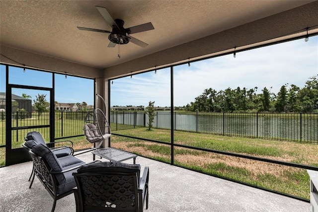12646 Oak Hill Way, Parrish, FL 34219 - sunroom featuring ceiling fan and a water view
