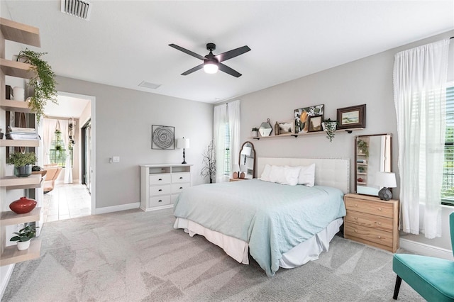12646 Oak Hill Way, Parrish, FL 34219 - carpeted bedroom with multiple windows and ceiling fan