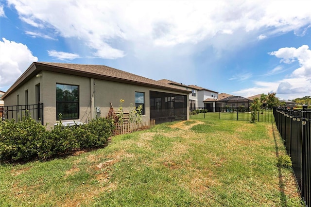 12646 Oak Hill Way, Parrish, FL 34219 - back of property featuring stucco siding, a sunroom, and a fenced backyard