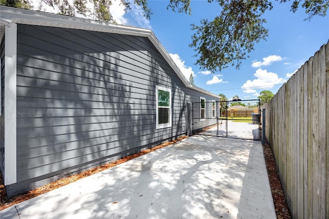 2859 38th Ave N, Saint Petersburg, FL 33713 - view of home's exterior with a gate and a patio area