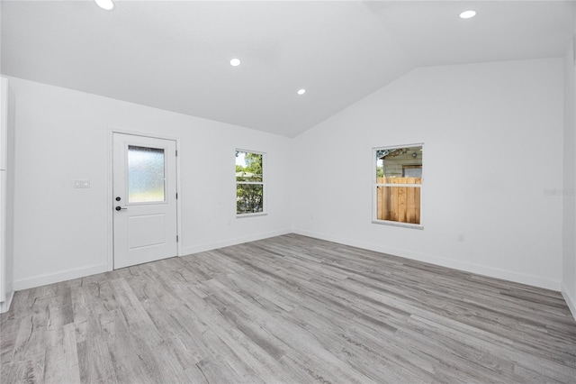 2859 38th Ave N, Saint Petersburg, FL 33713 - spare room featuring wood finished floors, lofted ceiling, and recessed lighting