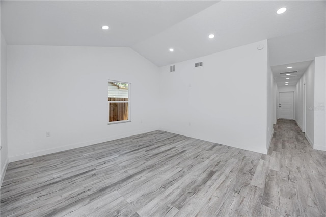 2859 38th Ave N, Saint Petersburg, FL 33713 - spare room featuring light wood-style flooring, recessed lighting, and vaulted ceiling