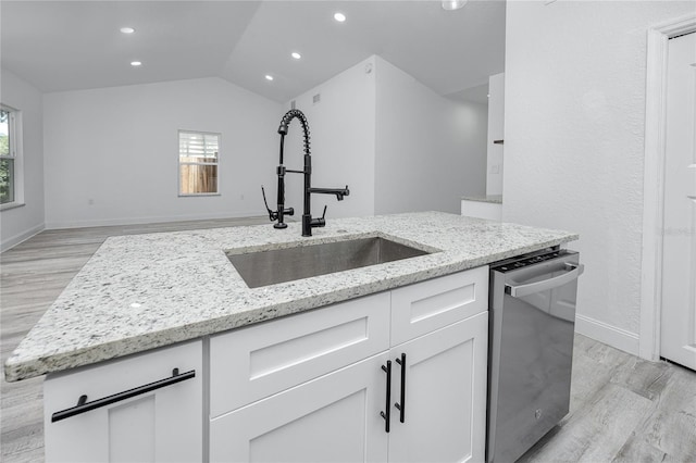 2859 38th Ave N, Saint Petersburg, FL 33713 - kitchen with stainless steel dishwasher, light wood-style floors, plenty of natural light, lofted ceiling, and recessed lighting