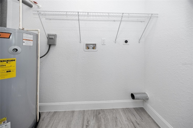 2859 38th Ave N, Saint Petersburg, FL 33713 - washroom with hookup for an electric dryer, water heater, wood finished floors, and hookup for a washing machine