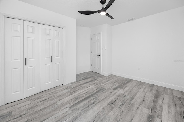 2859 38th Ave N, Saint Petersburg, FL 33713 - unfurnished bedroom featuring wood finished floors, a closet, and ceiling fan