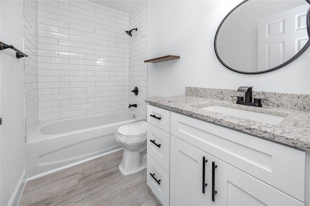 2859 38th Ave N, Saint Petersburg, FL 33713 - full bath with wood finished floors, vanity, and tub / shower combination