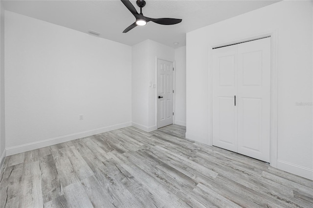 2859 38th Ave N, Saint Petersburg, FL 33713 - unfurnished bedroom featuring wood finished floors, a closet, and ceiling fan