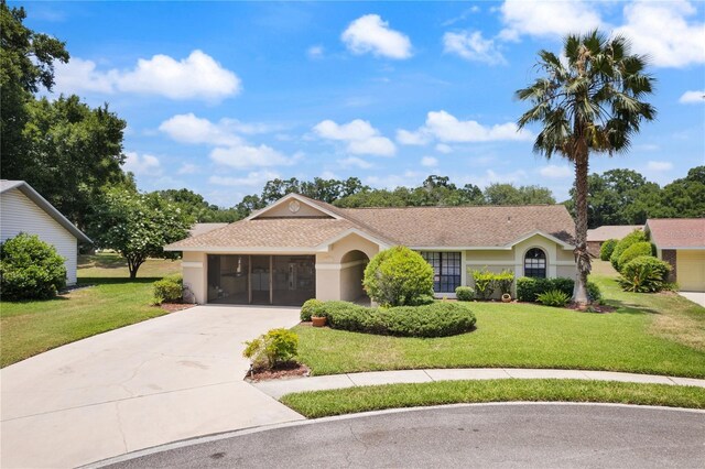 37147 Foxrun Pl, Zephyrhills, FL 33542 - ranch-style home featuring concrete driveway, a front yard, and stucco siding