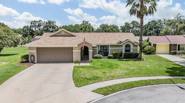 37147 Foxrun Pl, Zephyrhills, FL 33542 - ranch-style home featuring stucco siding, an attached garage, concrete driveway, and a front lawn