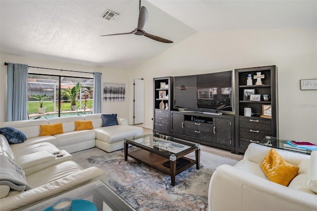 37147 Foxrun Pl, Zephyrhills, FL 33542 - living area featuring a ceiling fan, lofted ceiling, and wood finished floors