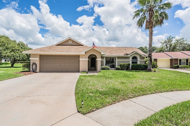 37147 Foxrun Pl, Zephyrhills, FL 33542 - ranch-style home with stucco siding, concrete driveway, an attached garage, and a front lawn