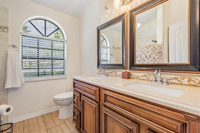 37147 Foxrun Pl, Zephyrhills, FL 33542 - bathroom with plenty of natural light, double vanity, tiled shower, and tile patterned flooring