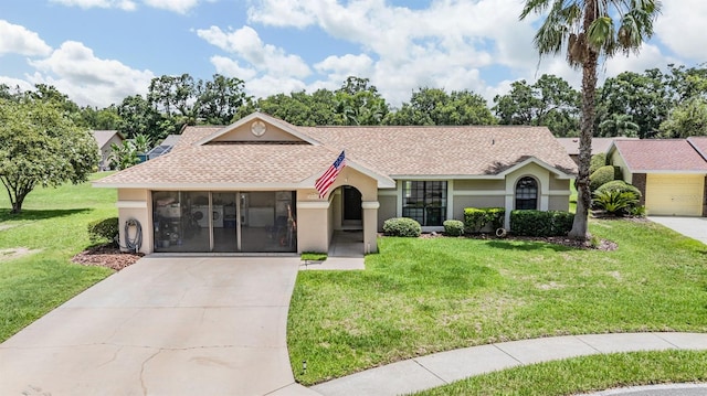 37147 Foxrun Pl, Zephyrhills, FL 33542 - single story home with stucco siding, roof with shingles, driveway, a front lawn, and a sunroom