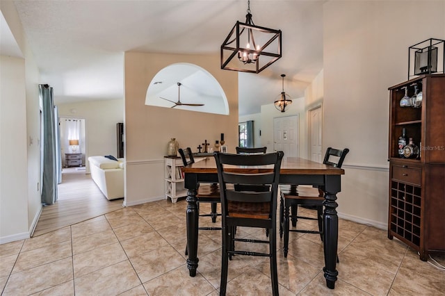 37147 Foxrun Pl, Zephyrhills, FL 33542 - dining area featuring lofted ceiling, a chandelier, light tile patterned flooring, and ceiling fan