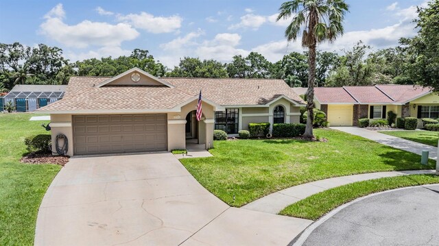 37147 Foxrun Pl, Zephyrhills, FL 33542 - ranch-style house featuring a garage, concrete driveway, stucco siding, a front yard, and roof with shingles