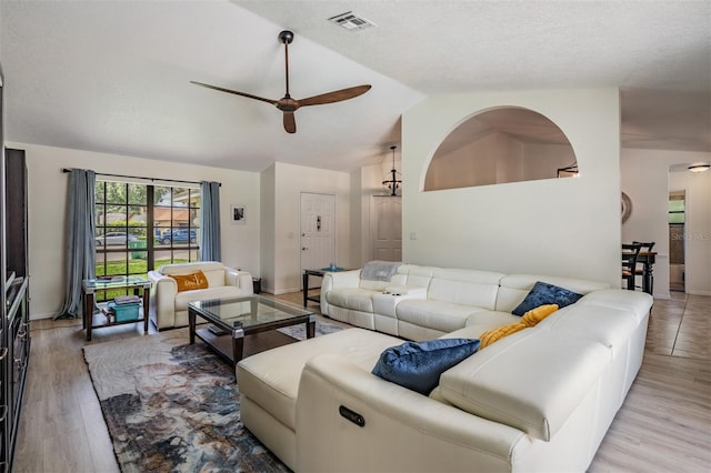 37147 Foxrun Pl, Zephyrhills, FL 33542 - living room featuring lofted ceiling, a ceiling fan, and wood finished floors