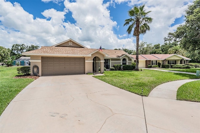 37147 Foxrun Pl, Zephyrhills, FL 33542 - single story home with stucco siding, a front yard, an attached garage, and driveway