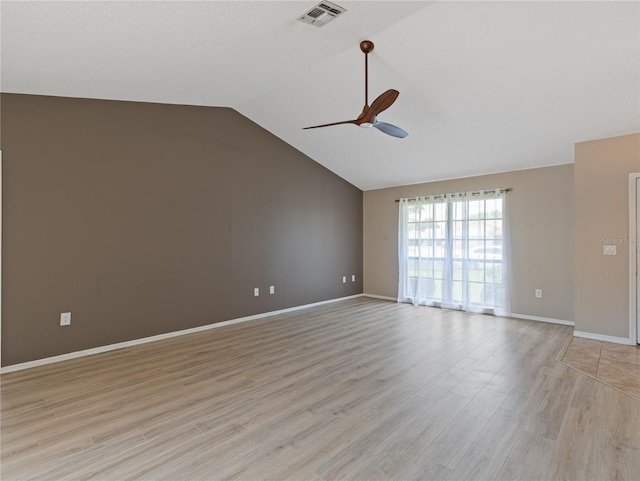 37147 Foxrun Pl, Zephyrhills, FL 33542 - spare room with a ceiling fan, light wood-type flooring, and lofted ceiling