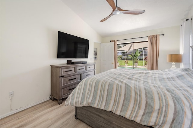 37147 Foxrun Pl, Zephyrhills, FL 33542 - bedroom featuring light wood finished floors, vaulted ceiling, access to outside, and ceiling fan