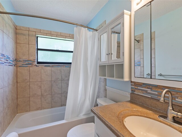 37147 Foxrun Pl, Zephyrhills, FL 33542 - full bathroom with shower / bath combination with curtain, vanity, a textured ceiling, and decorative backsplash