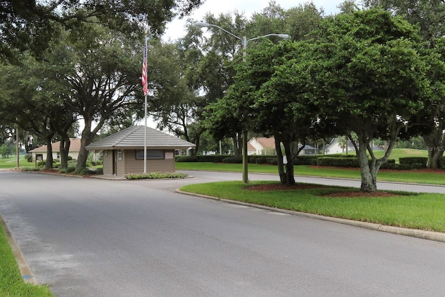 37147 Foxrun Pl, Zephyrhills, FL 33542 - view of asphalt street featuring street lights and curbs