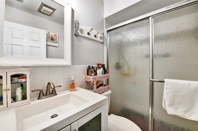 2700 Bayshore Blvd Unit 544, Dunedin, FL 34698 - full bathroom with tasteful backsplash, vanity, a shower with door, and tile walls