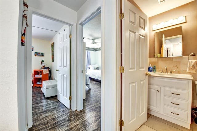 2700 Bayshore Blvd Unit 544, Dunedin, FL 34698 - corridor with a sink and light wood-style floors