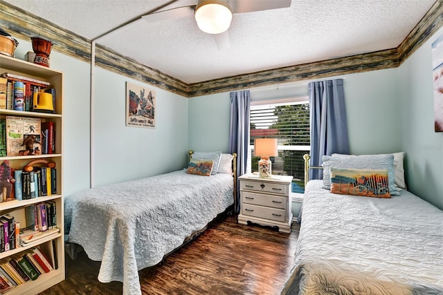 2700 Bayshore Blvd Unit 544, Dunedin, FL 34698 - bedroom featuring a textured ceiling, dark wood-type flooring, ceiling fan, and crown molding