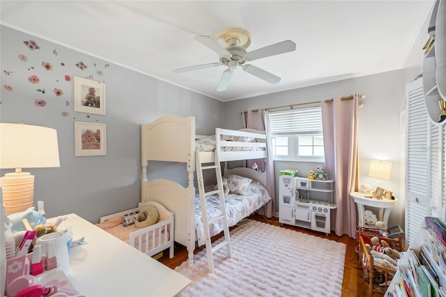 4521 S Cooper Pl, Tampa, FL 33611 - bedroom with wood finished floors, ceiling fan, and ornamental molding
