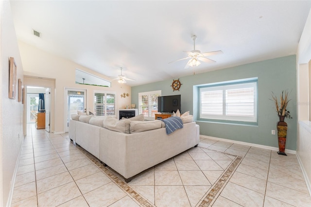 835 Symphony Isles Blvd, Apollo Beach, FL 33572 - living room with ceiling fan, light tile patterned flooring, and a fireplace