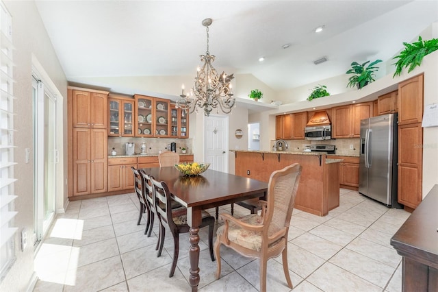 835 Symphony Isles Blvd, Apollo Beach, FL 33572 - dining area with a chandelier, lofted ceiling, light tile patterned flooring, and recessed lighting