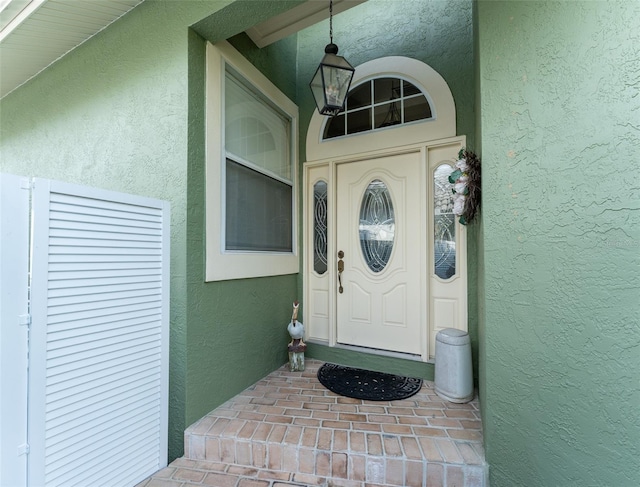 835 Symphony Isles Blvd, Apollo Beach, FL 33572 - view of exterior entry featuring stucco siding