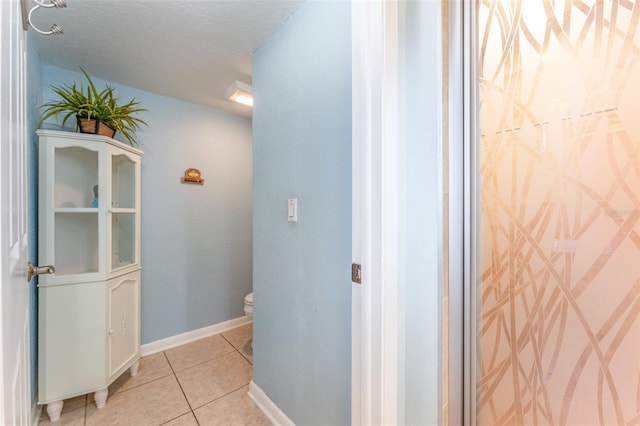 835 Symphony Isles Blvd, Apollo Beach, FL 33572 - bathroom with toilet and tile patterned floors