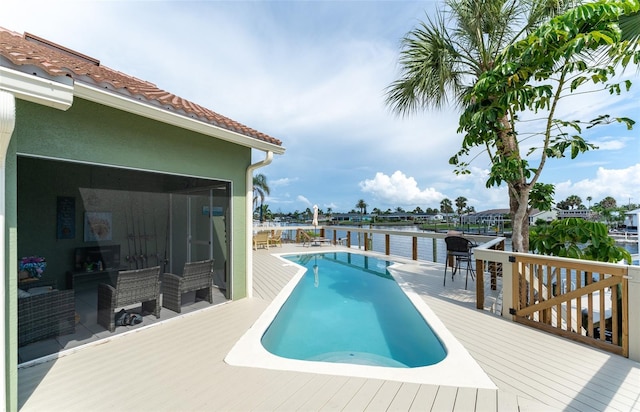 835 Symphony Isles Blvd, Apollo Beach, FL 33572 - swimming pool featuring a deck with water view