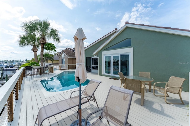 835 Symphony Isles Blvd, Apollo Beach, FL 33572 - wooden deck with outdoor dining area