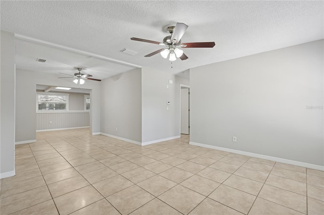 129 Magnolia Ave, Seffner, FL 33584 - empty room featuring a textured ceiling, ceiling fan, and light tile patterned floors