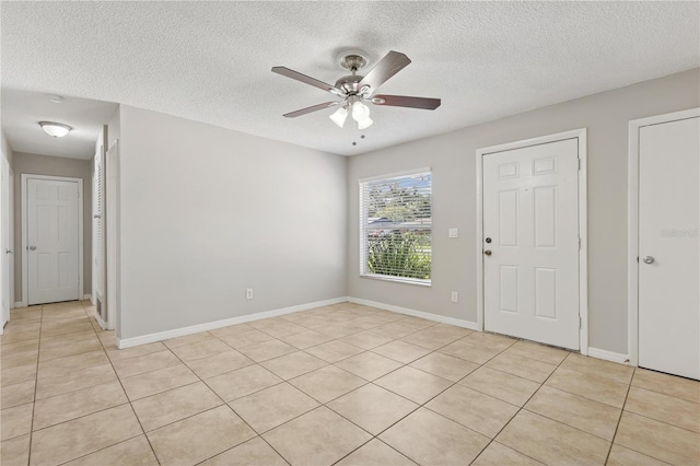 129 Magnolia Ave, Seffner, FL 33584 - unfurnished room with a ceiling fan, a textured ceiling, and light tile patterned floors
