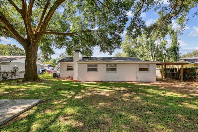 129 Magnolia Ave, Seffner, FL 33584 - back of property featuring a chimney