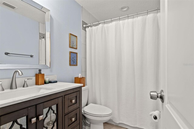 3135 W Varn Ave, Tampa, FL 33611 - full bathroom with vanity and a textured ceiling
