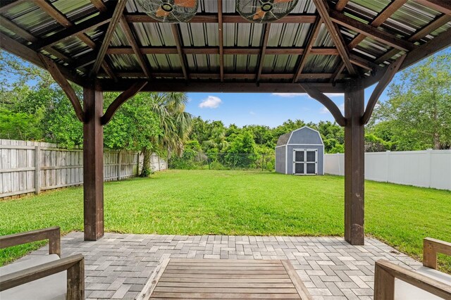 3135 W Varn Ave, Tampa, FL 33611 - fenced backyard featuring a patio, a shed, and a gazebo