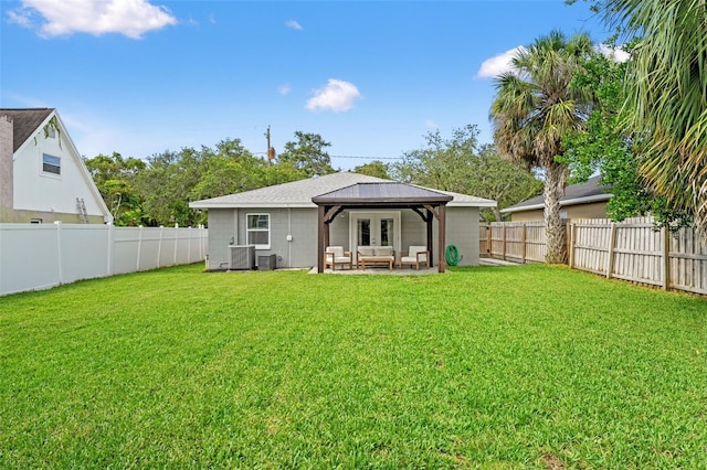 3135 W Varn Ave, Tampa, FL 33611 - rear view of house with a gazebo, outdoor lounge area, a fenced backyard, and a patio