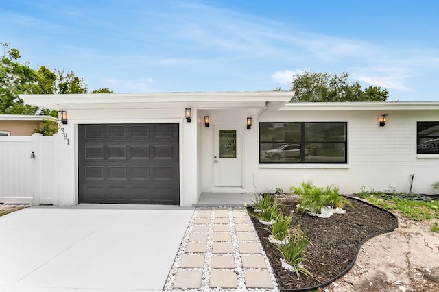 3381 19th Pl SW, Largo, FL 33774 - view of front of house with a garage and concrete driveway