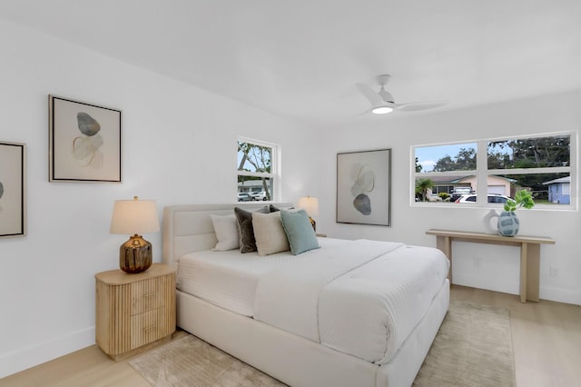 3381 19th Pl SW, Largo, FL 33774 - bedroom with light wood-type flooring and a ceiling fan