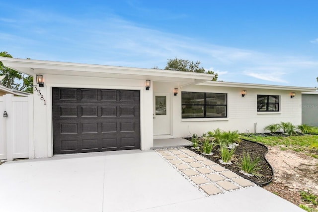3381 19th Pl SW, Largo, FL 33774 - view of front of property with a garage and concrete driveway